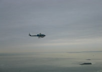 friendly visitors with a view of Sandy Hook NJ in the back ground